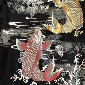 Black T shirt with gold and red coy fish design.